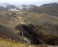 Waterfall formed by the river coming down the Mutnovsky volcano.