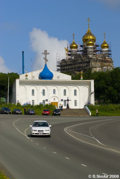 New Russian church being built behind the old one.